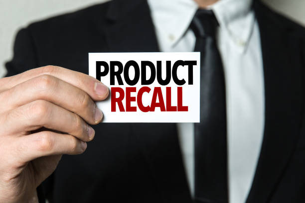Businessman holding a card written: Product Recall Product Recall card sign defection stock pictures, royalty-free photos & images
