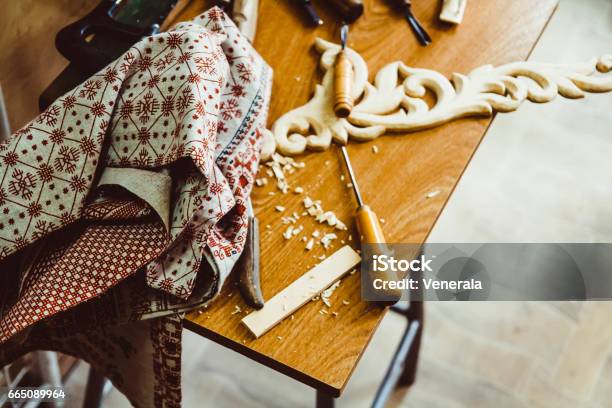 A Craftsman Carves Wood Stock Photo - Download Image Now - Activity, Art, Brown