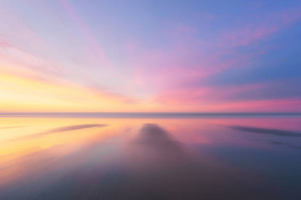 istock beautiful background of beach at sunset 665092778