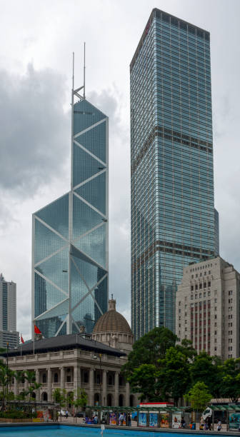 Bank of China Tower and the Cheung Kong Center Hong Kong, China - August 17 2007: Old Supreme Court Building and the Bank Of China Building dwarfed by the Bank of China Tower and the Cheung Kong Center. the bank of china tower stock pictures, royalty-free photos & images