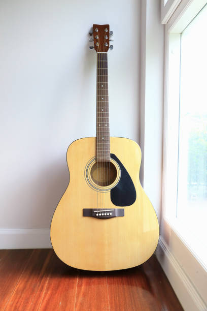 istock Guitar near the windows, as background. 665097922