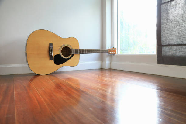 istock Guitar near the windows, as background. 665097944
