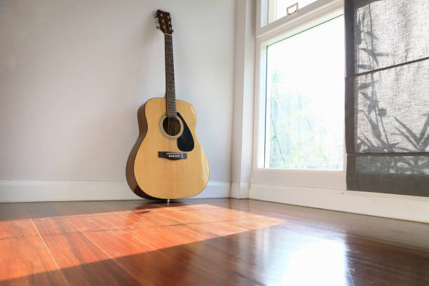 istock Guitar near the windows, as background. 665098244
