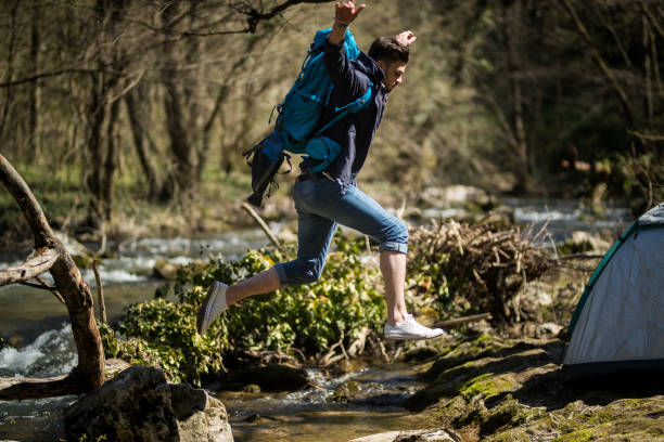 istock Final jump to cross the river 665098838