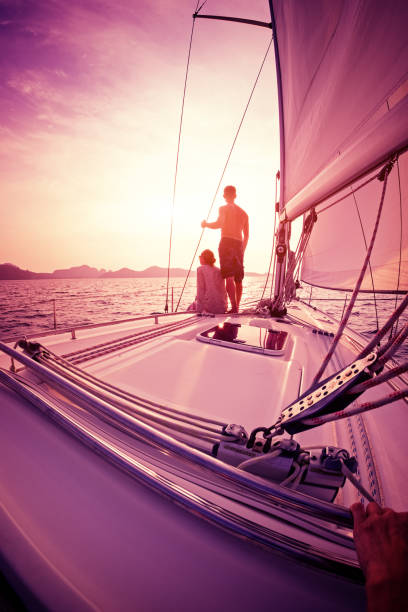 istock Couple enjoying sunset from the sail boat 665101190
