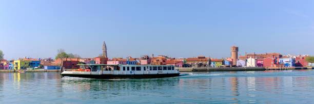 The ferry connects several times a day Venice with the islands of its lagoon, including Burano, well known for its lace work and brightly coloured houses.