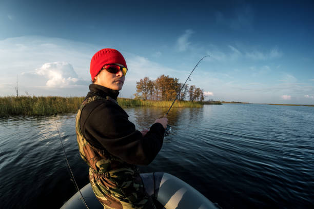 istock Man fishing on the lake 665112736
