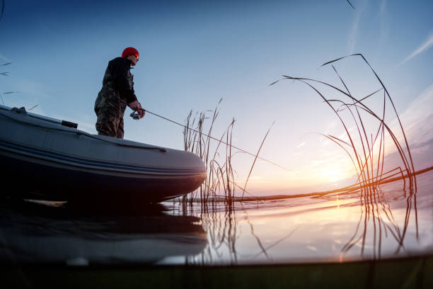 istock Man fishing on the lake 665113574