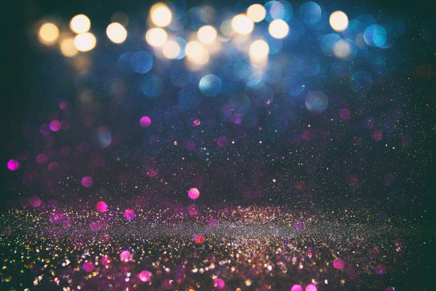 istock glitter vintage lights background. de-focused 665117350
