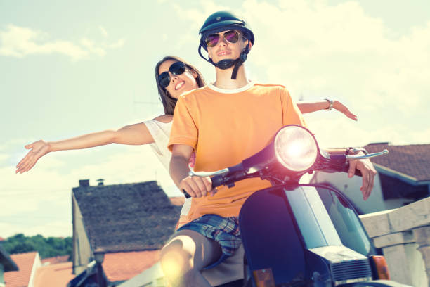 istock Happy couple on a scooter at summer vacation 665117550