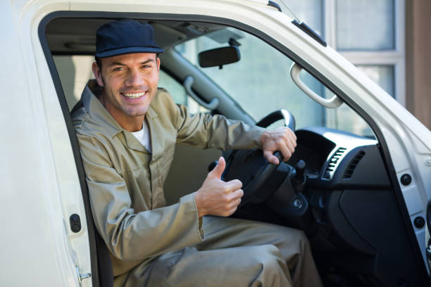 istock Delivery man sitting in his van 665127264