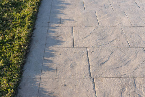 istock Stamped concrete pavement outdoor slate stone pattern, decorative appearance colors and textures of paving   tile on ceme 665127418