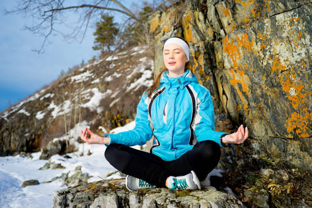 istock Girl meditating in nature 665127428