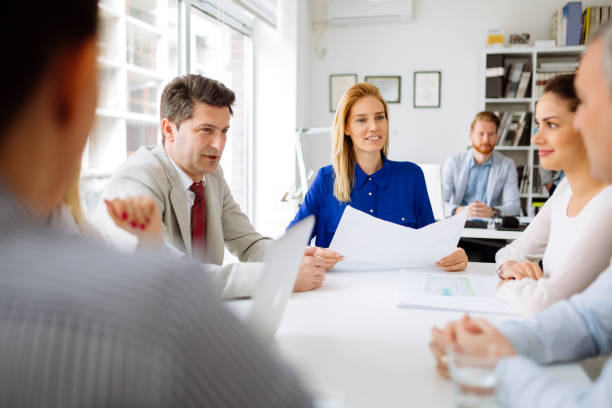 istock Businesspeople and architects planning for the future 665136192