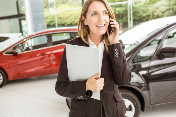 istock Smiling saleswoman having a phone call 665140018