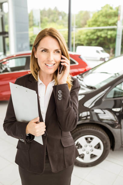 istock Smiling saleswoman having a phone call 665140046