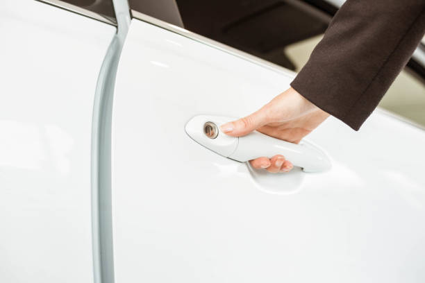 istock Saleswoman holding a car handles 665140170