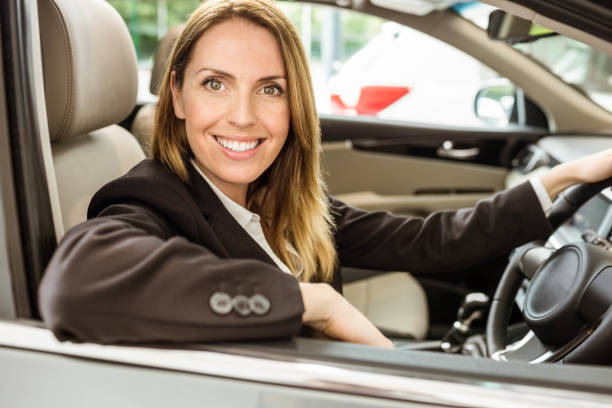 istock Smiling businesswoman siting in a car 665142910