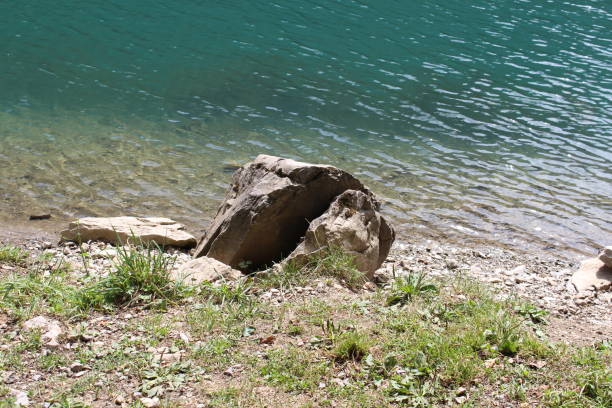 istock Blue pond with green land 665143214