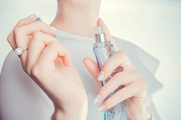 istock Woman applying perfume on her wrist 665147632