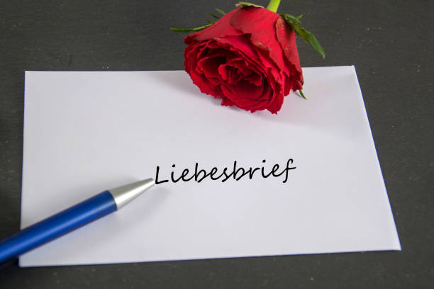 envelope with rose and pen