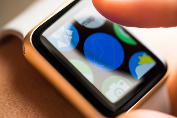 istock Finger touching email app icon on smart watch screen 665147806