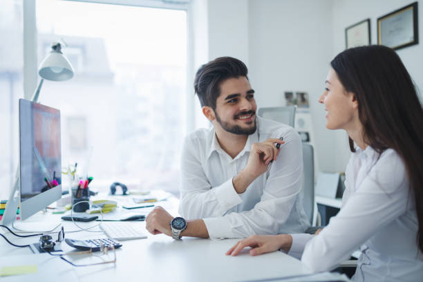 istock Happy collaborating business colleagues discussing future plans 665150124