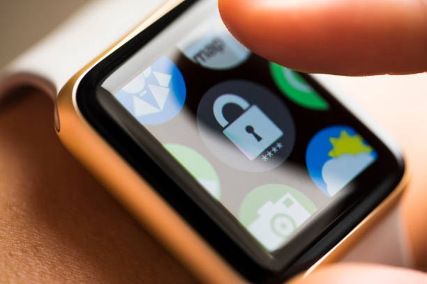 istock Finger touching padlock password app icon on smart watch screen 665150432