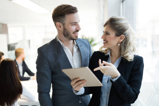 istock Professional business people cooperating in company office 665150728