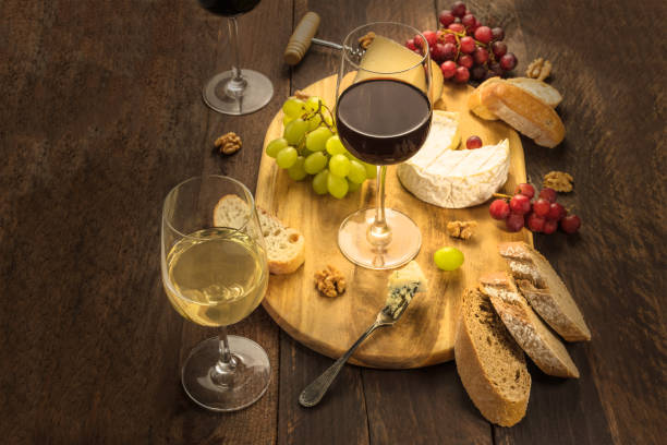 istock Wine and cheese tasting with bread and grapes 665153598