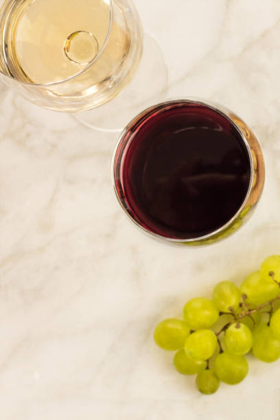 istock Glasses of red and white wine at tasting 665153906