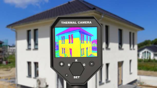 Detecting Heat Loss at the House With Infrared Thermal Camera stock photo