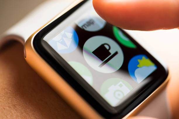 istock Finger touching coffee cup app icon on smart watch screen 665158778