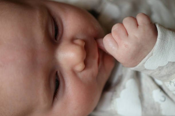 istock People: Baby sucking fingers 665159164