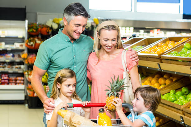 istock Young family behind their trolley 665159272