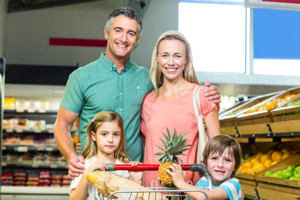 istock Young Family posing together with trolley 665161700