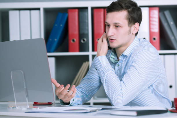 istock Serious bznesmen talking on the phone in the office 665162068