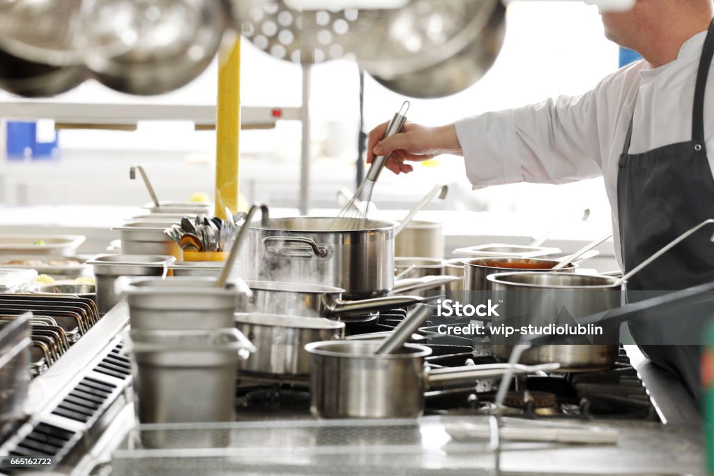 Professional kitchen in a restaurant chef at work Commercial Kitchen Stock Photo