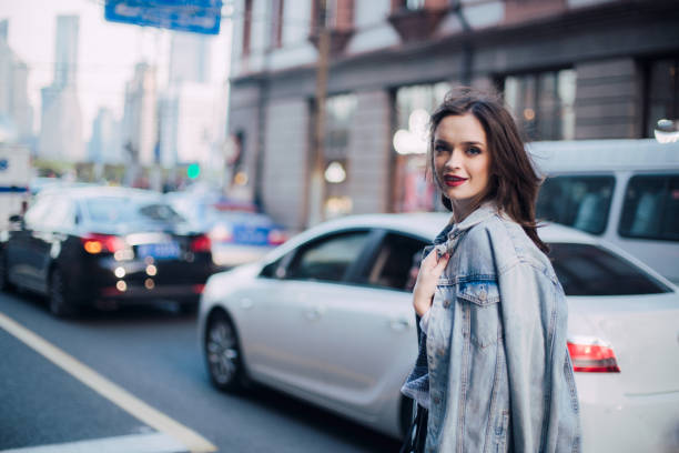 istock Charming young woman on the street 665169862