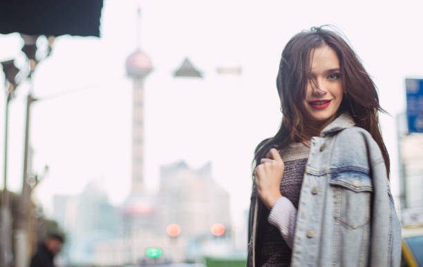 istock Charming woman smiling on the street 665170344