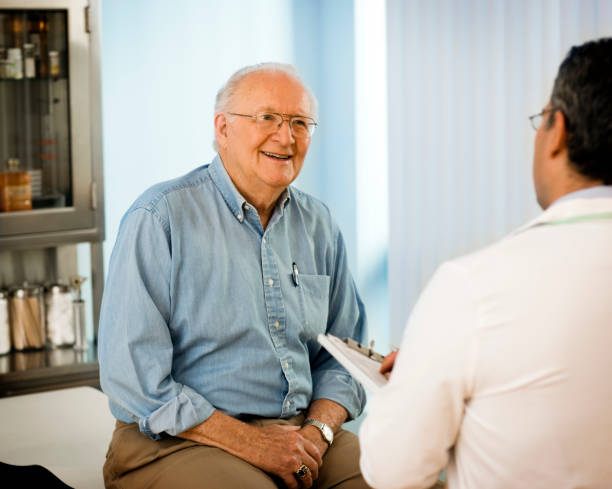 istock Senior couple talking with doctor. 665174920