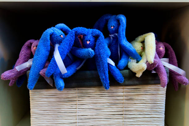 istock colorful handmade bunnies sitting in a basket 665181306