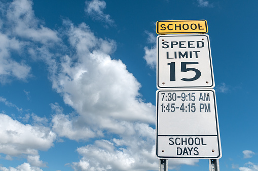 School limited speed signal in a sunny day