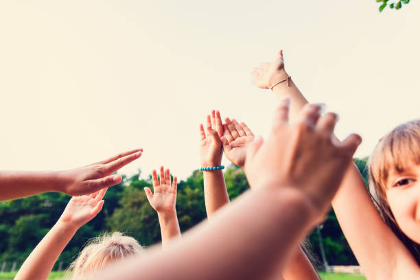istock Group of Children with Arms Up 665195936