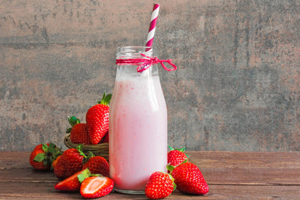 istock Strawberry smoothie or milkshake in a bottle with straw 665197264