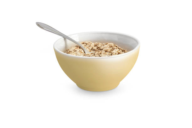 istock Oatmeal or dry cereal in a yellow bowl 665197850