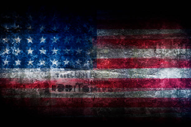 istock Grunge US flag on stone texture background closeup 665203428