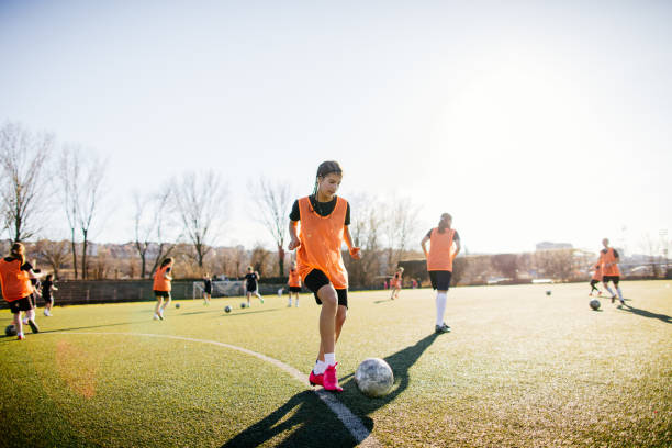 istock Female soccer player and her team mates 665206298
