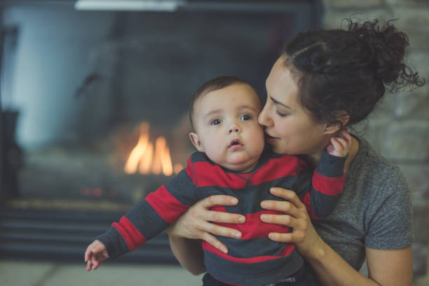 istock Young ethnic mother holding infant son 665212540