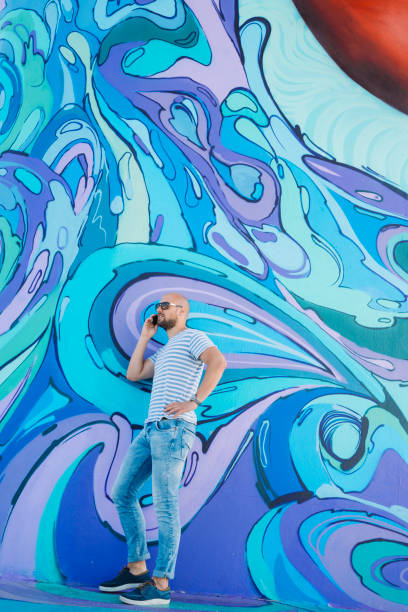 istock Hipster Male Next to Wall of Graffiti in Belgrade 665213048